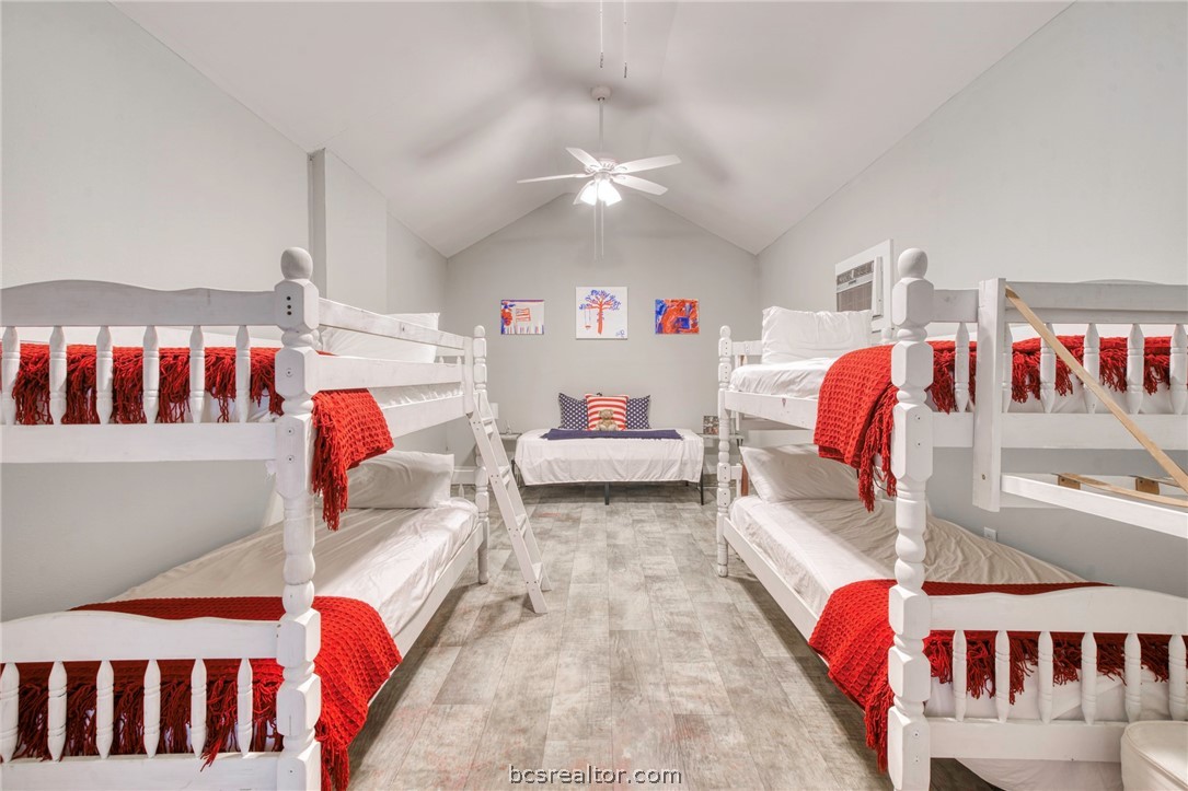 11452 Riley Green Road Franklin, TX 77856 - Photo 16 of 31 a bedroom with bed and a walk in closet