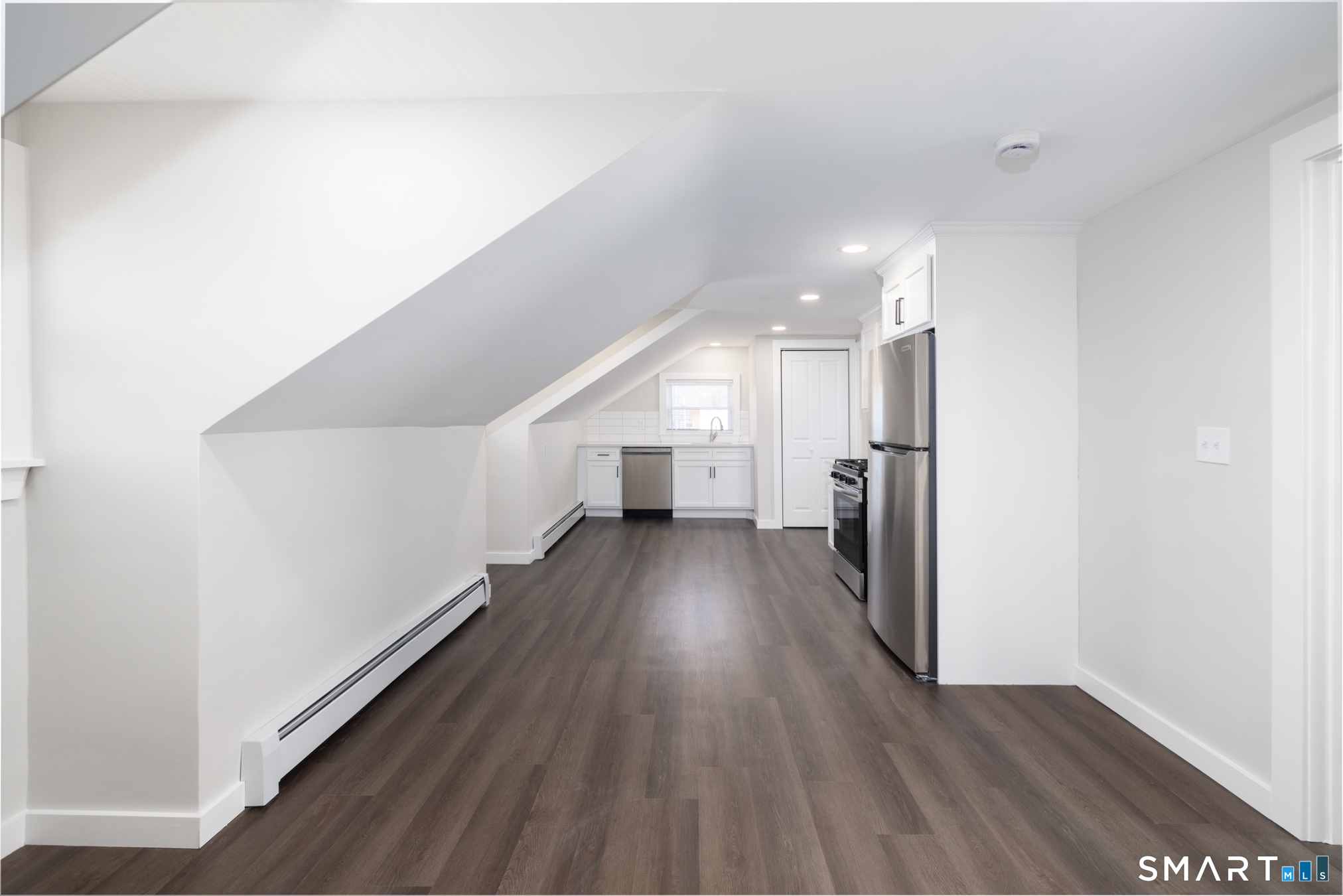 28 Aircraft Road, Unit J Southington, CT 06489 - Photo 13 of 18 a view of a hallway with wooden floor