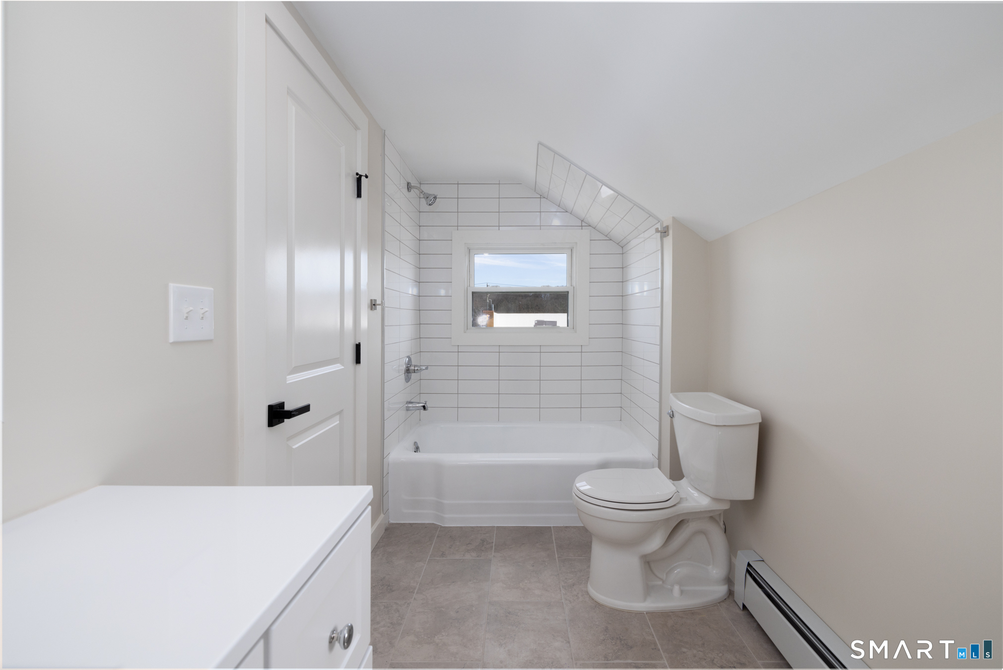 28 Aircraft Road, Unit J Southington, CT 06489 - Photo 7 of 18 a bathroom with a sink a toilet and shower