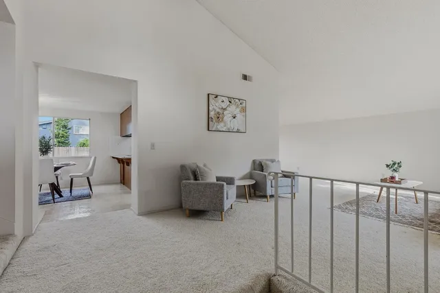 a view of a livingroom with furniture and windows