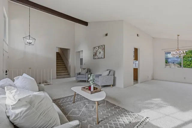 a living room with furniture and a rug