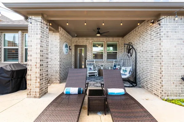 a view of balcony with chairs and wooden floor