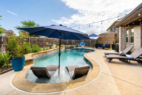 a view of a swimming pool with a patio