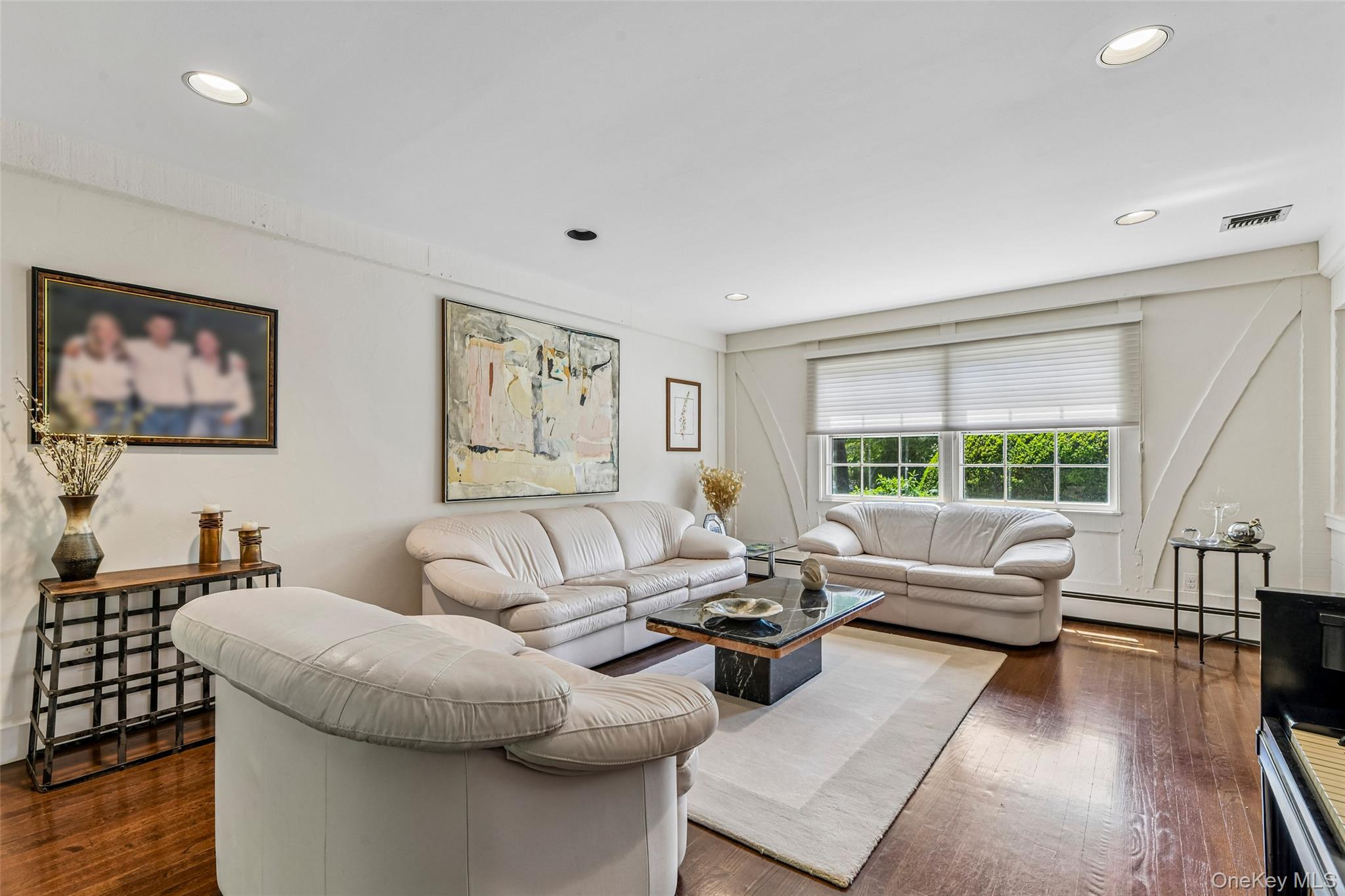 100 Hewlett Neck Road Woodmere, NY 11598 - Photo 7 of 45 a living room with furniture and a large window