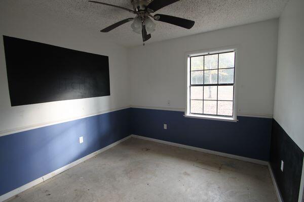 6047 Eden Square Crestview, FL 32539 - Photo 22 of 39 wooden floor in an empty room with a window