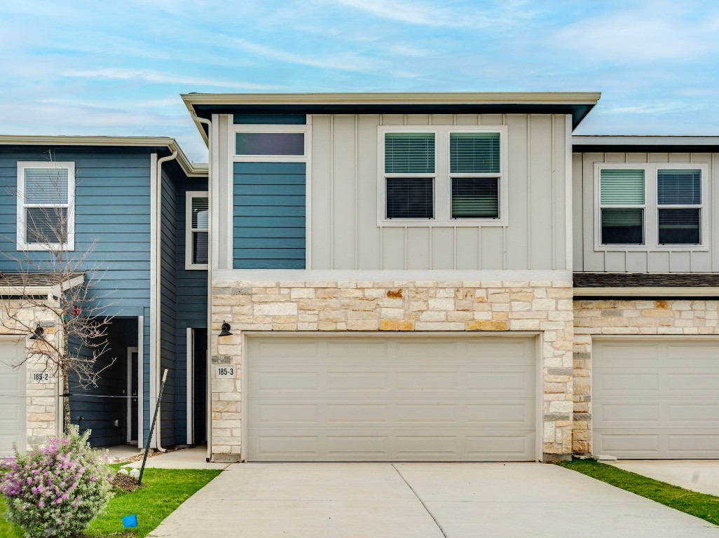 a front view of a house with a garden