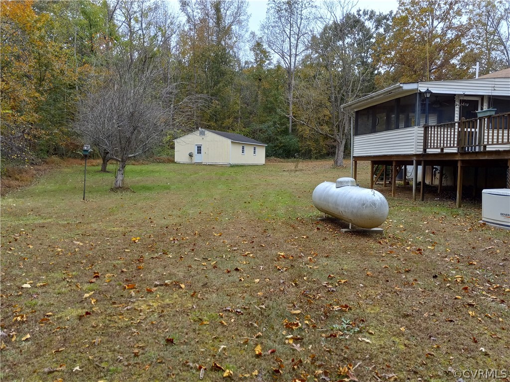 2964 West Creek Road Crewe, VA 23930 - Photo 37 of 46 a backyard of a house with wooden fence and large trees