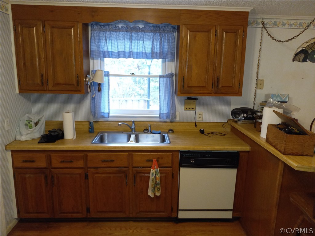 2964 West Creek Road Crewe, VA 23930 - Photo 9 of 46 a kitchen with kitchen island granite countertop wooden cabinets a sink and dishwasher