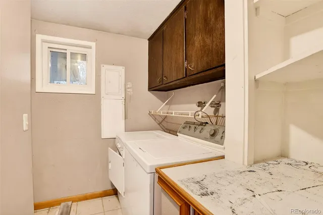 a view of a house with a yard covered in snow