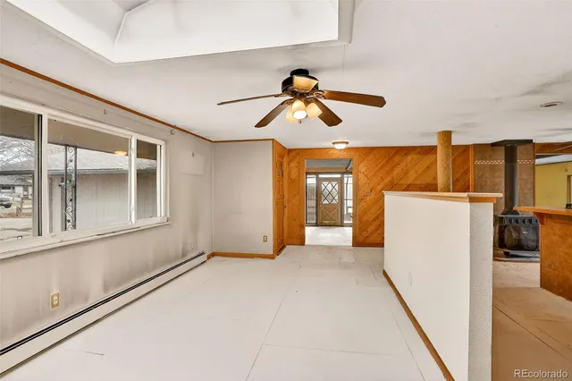 a view of an empty room and a bathroom