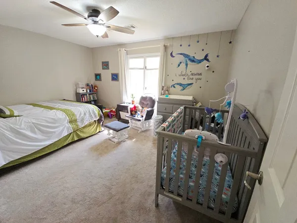 a bed room with a bed and a fish tank
