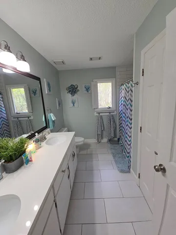 a room with a washing machine and sink