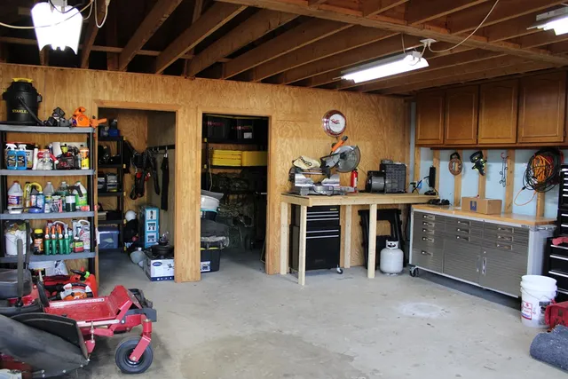 a backyard of a house with a large tree