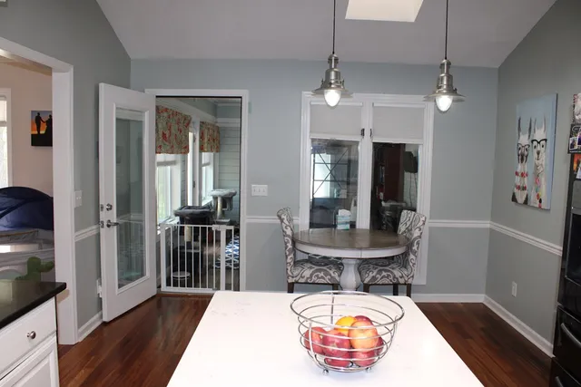 a room with furniture and wooden floor
