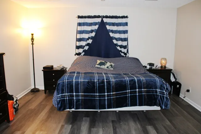 a bedroom with a bed and a closet