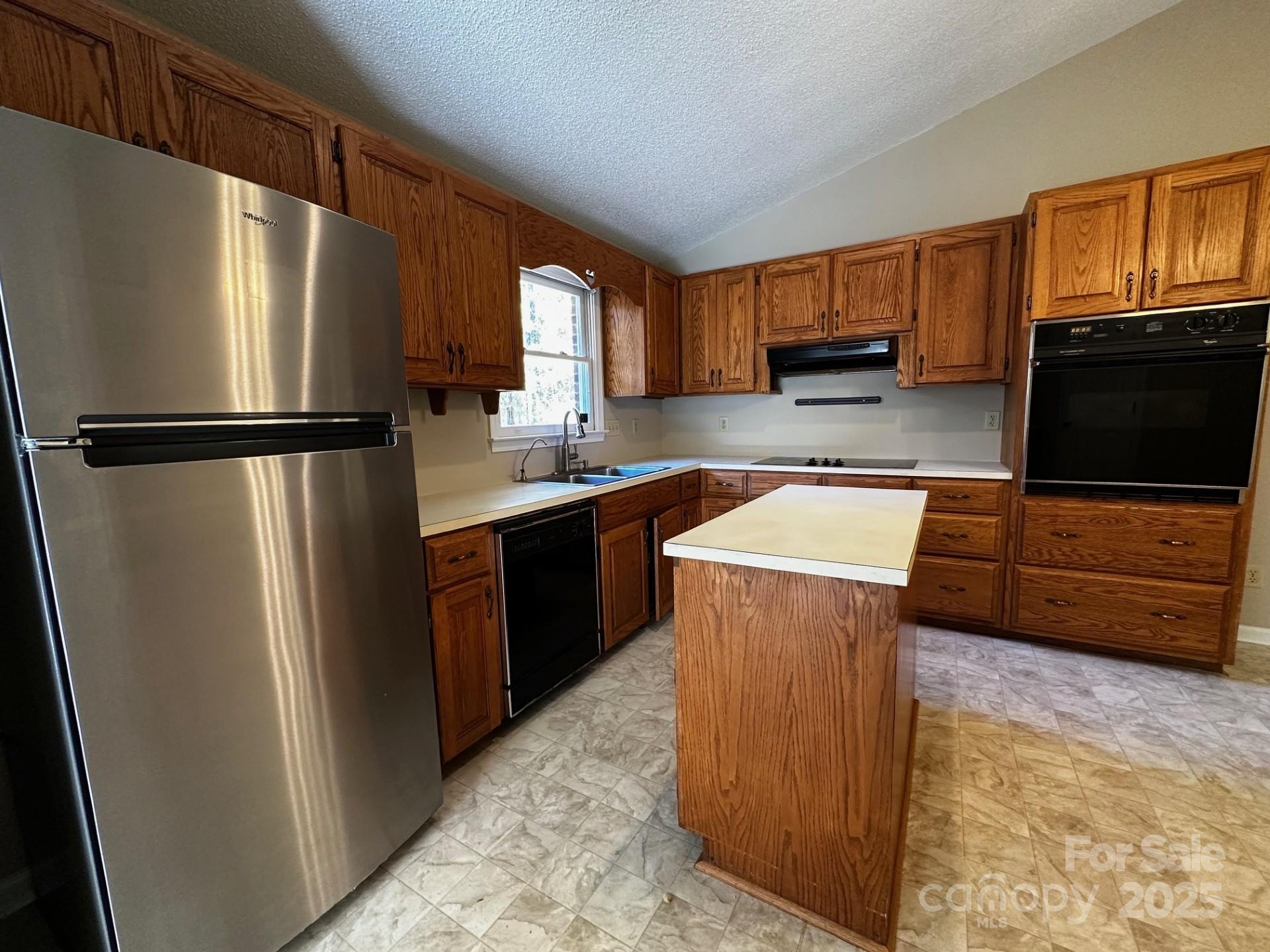1080 Gin Road Rockwell, NC 28138 - Photo 12 of 34 a kitchen with stainless steel appliances granite countertop a refrigerator a stove a sink and a microwave