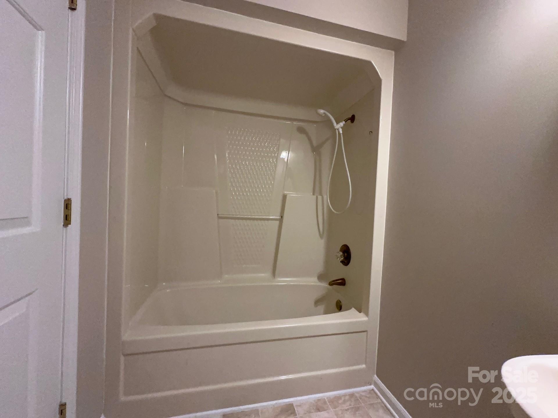 1080 Gin Road Rockwell, NC 28138 - Photo 25 of 34 a bathroom with a bathtub and a shower