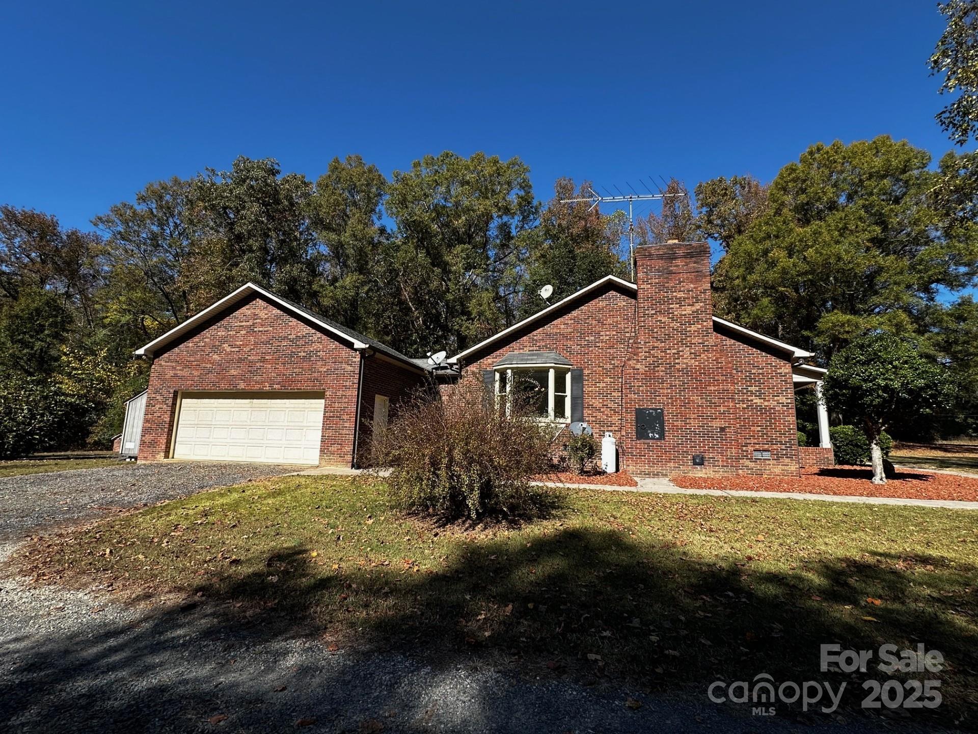 1080 Gin Road Rockwell, NC 28138 - Photo 27 of 34 a front view of a house with garden
