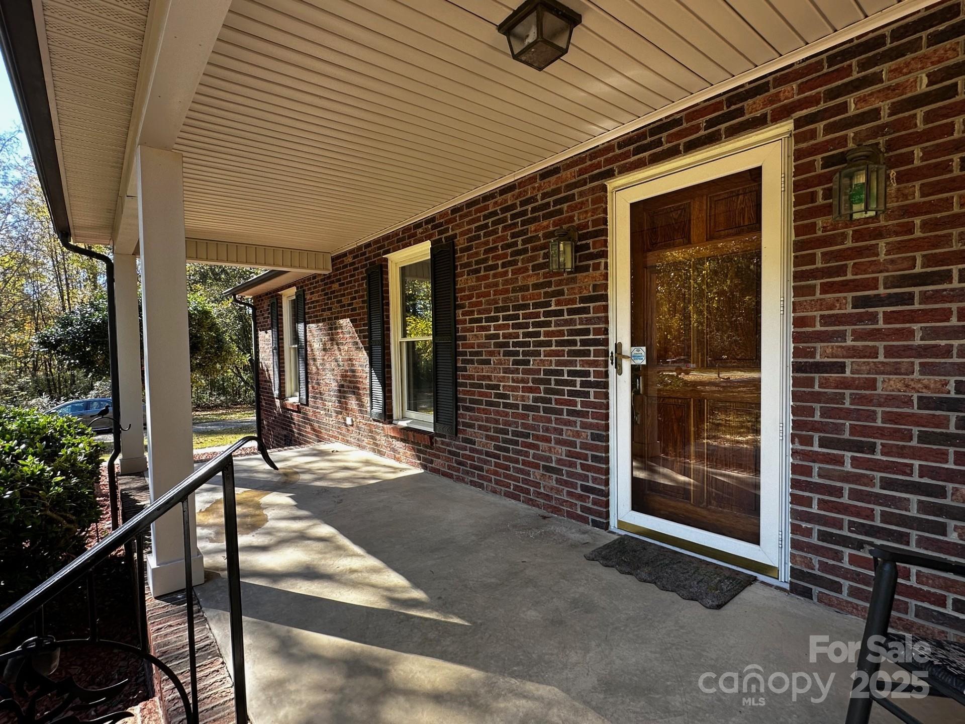 1080 Gin Road Rockwell, NC 28138 - Photo 3 of 34 a view of a porch with a table and chairs and potted plants