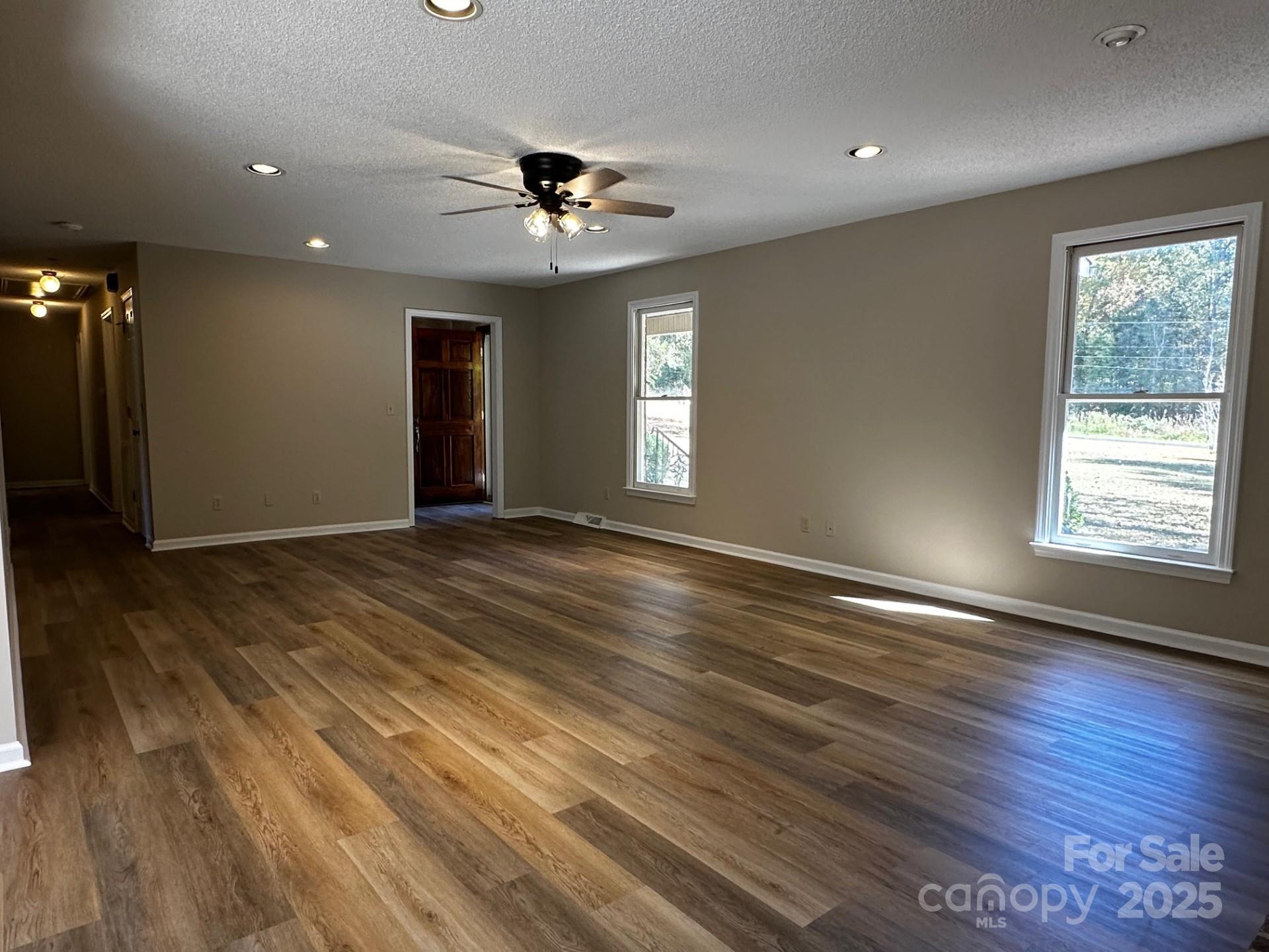 1080 Gin Road Rockwell, NC 28138 - Photo 8 of 34 a view of an empty room with wooden floor and a window