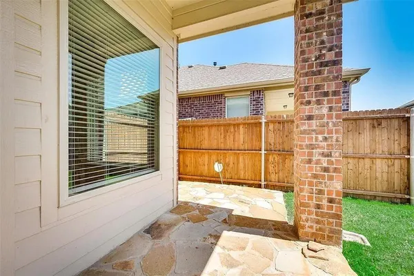 a view of front door of house with a yard