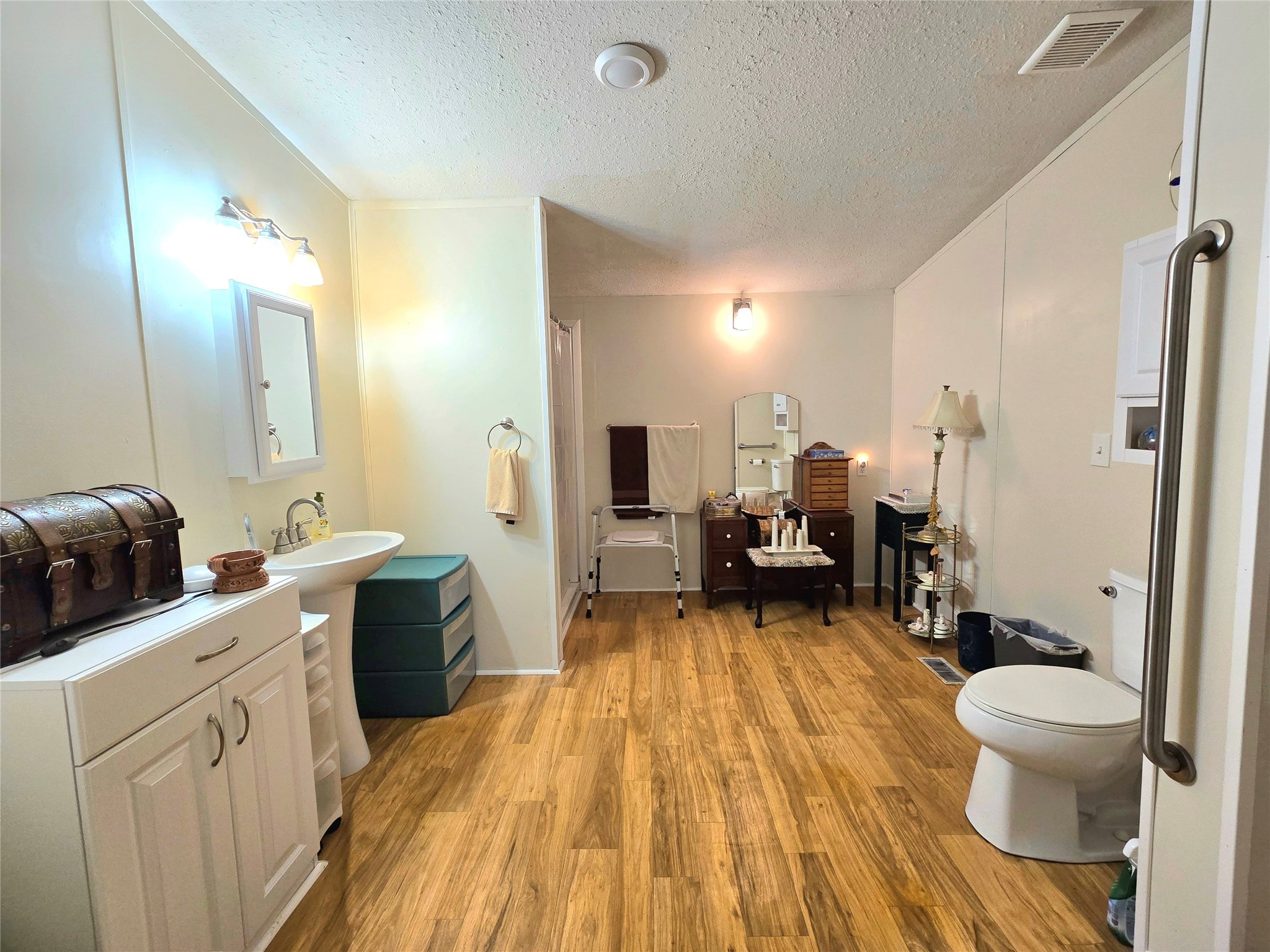 620 Easy Street Cleveland, TX 77327 - Photo 16 of 26 a view of a kitchen with a sink and wooden floor