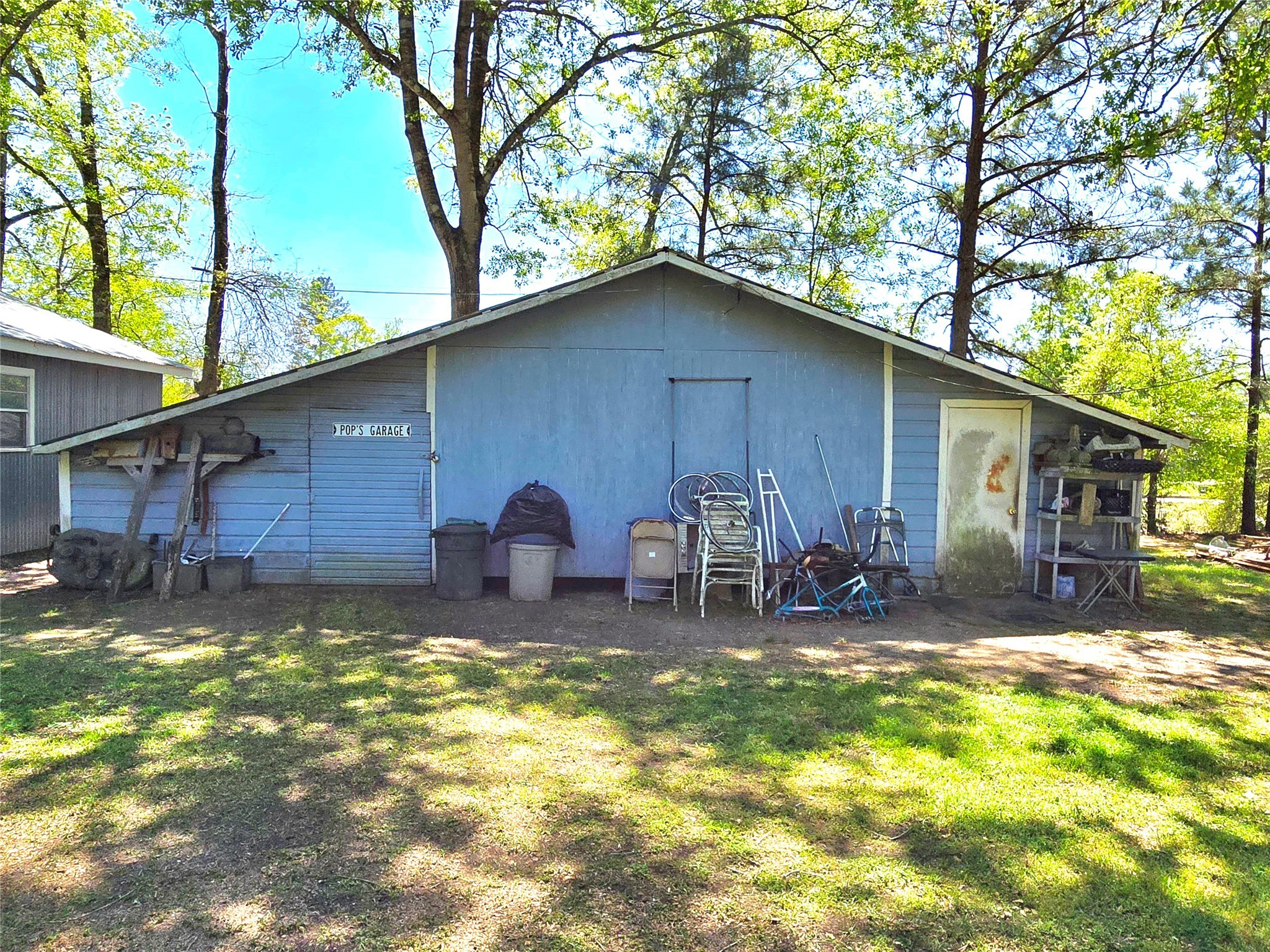 620 Easy Street Cleveland, TX 77327 - Photo 19 of 26 a backyard of a house with table and chairs