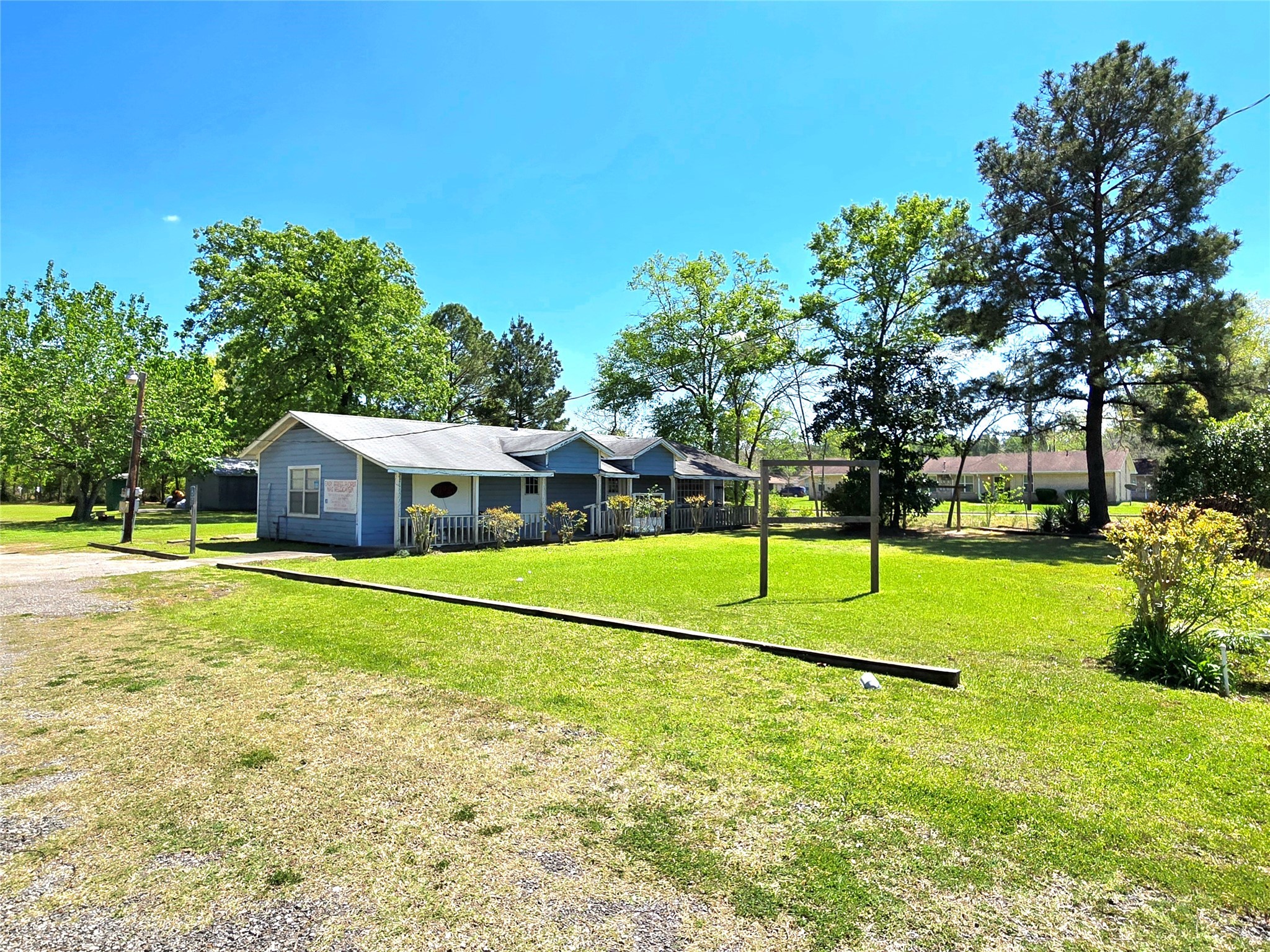 620 Easy Street Cleveland, TX 77327 - Photo 2 of 26 a house with trees in the background