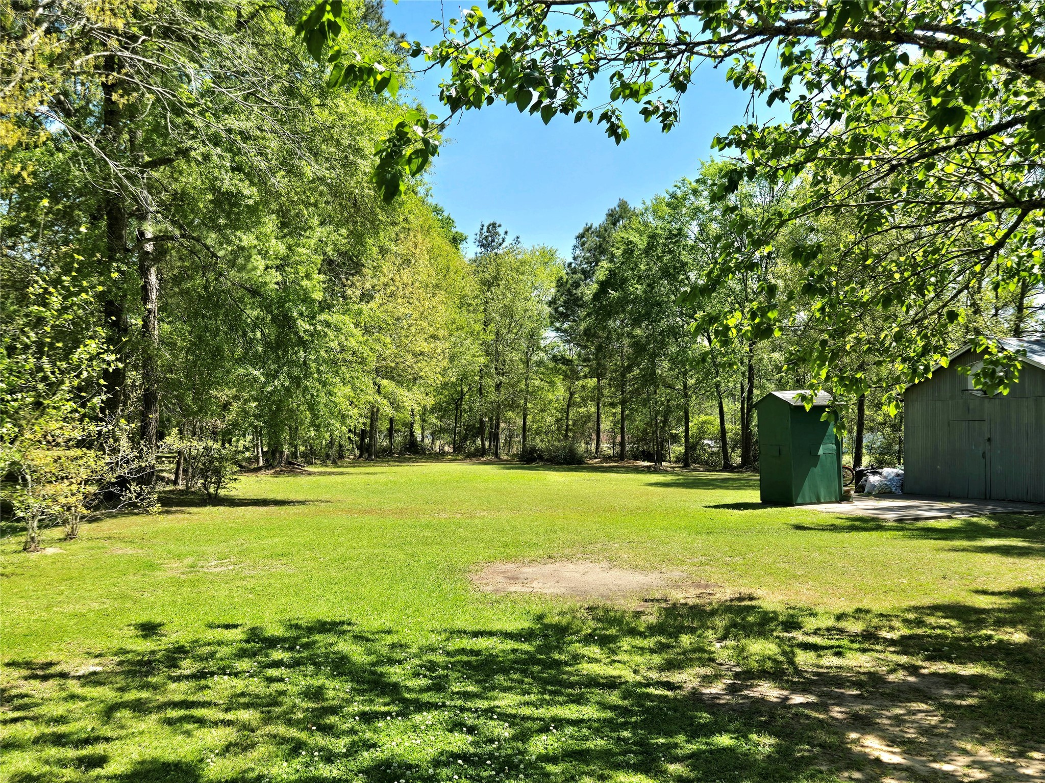 620 Easy Street Cleveland, TX 77327 - Photo 23 of 26 a view of a big yard with an outdoor space and seating