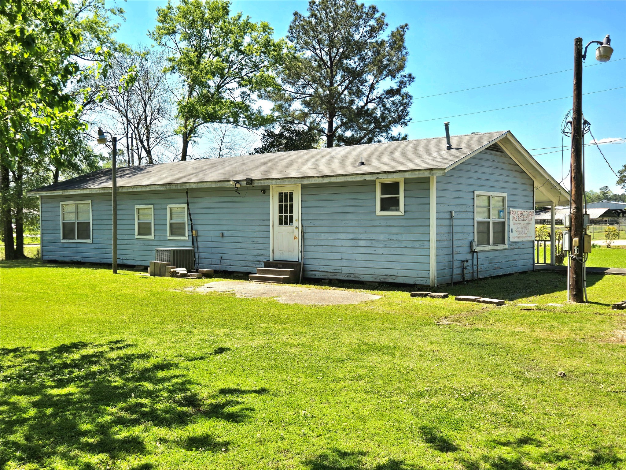 620 Easy Street Cleveland, TX 77327 - Photo 5 of 26 a front view of a house with a yard