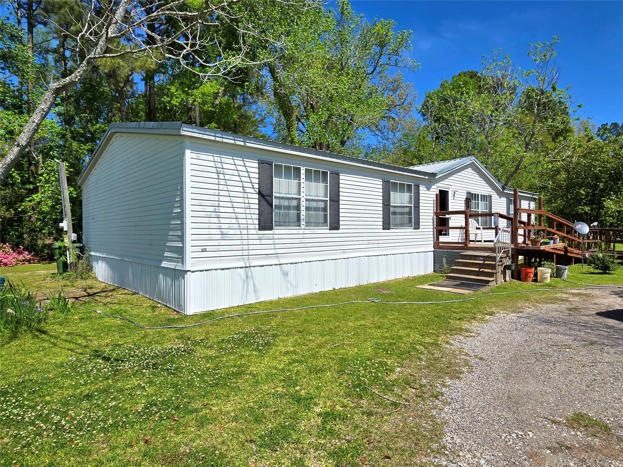 620 Easy Street Cleveland, TX 77327 - Photo 8 of 26 a view of a house with a backyard