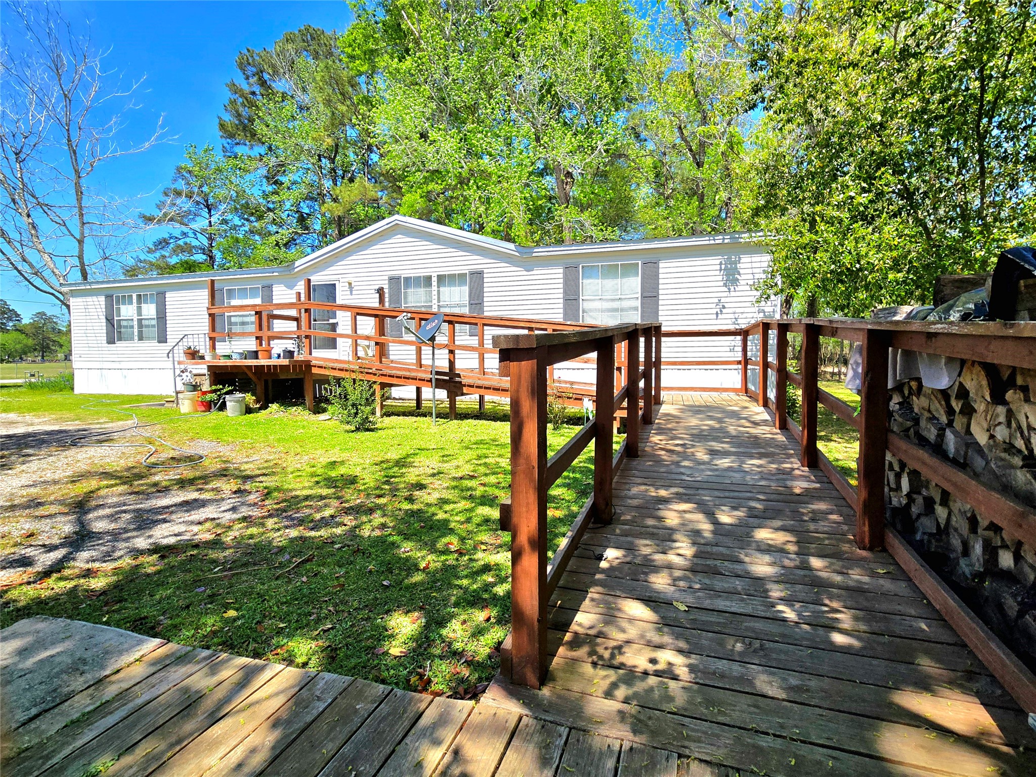 620 Easy Street Cleveland, TX 77327 - Photo 9 of 26 a front view of a house with yard