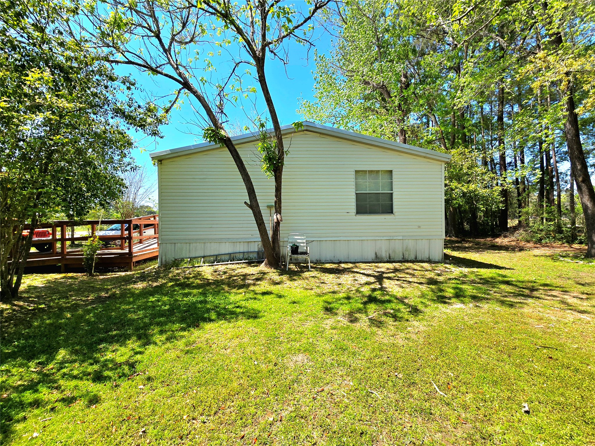 620 Easy Street Cleveland, TX 77327 - Photo 10 of 26 a backyard of a house with table and chairs