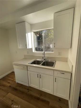 a room with a sink and cabinets