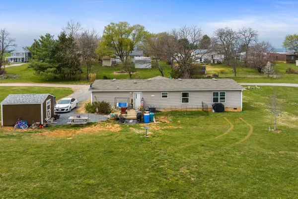 a view of a house with a big yard