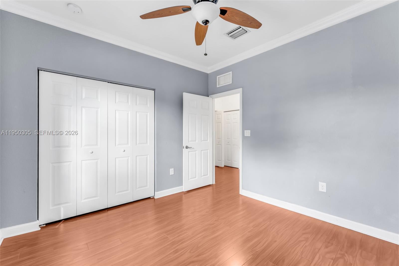 23465 Southwest 113 Passage Homestead, FL 33032 - Photo 15 of 30 a view of an empty room with wooden floor