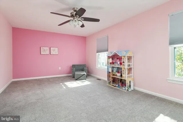 a bathroom with a sink vanity and a toilet