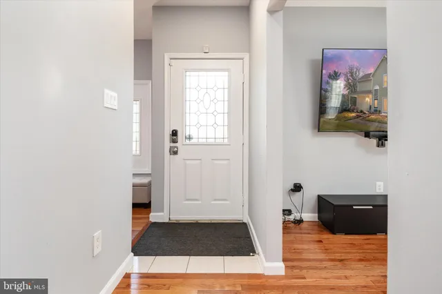 a view of kitchen with a sink cabinet and window