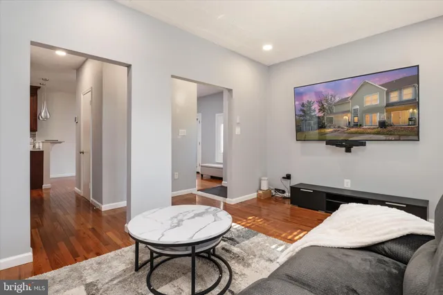 a bedroom with a bed and a table with mirror