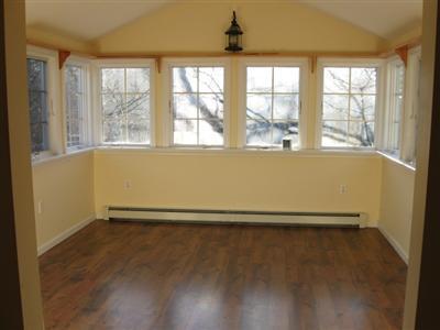1 18th Street South, Unit 12 Edgartown, MA 02539 - Photo 4 of 5 an empty room with wooden floor and windows