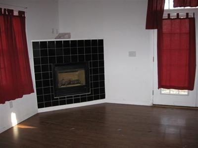 1 18th Street South, Unit 12 Edgartown, MA 02539 - Photo 5 of 5 a view of an empty room with wooden floor and a window
