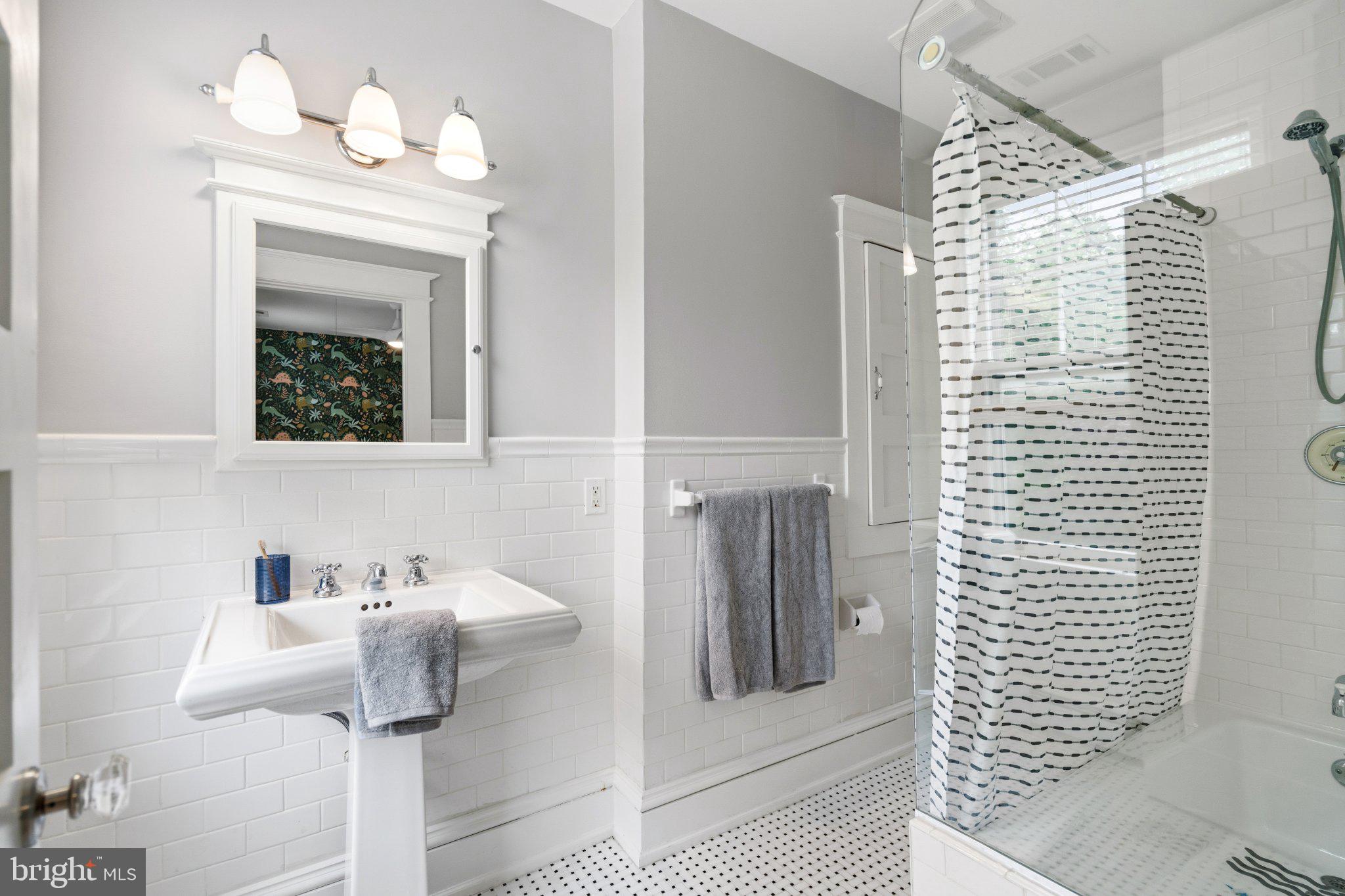 2934 Porter Street Northwest Washington, DC 20008 - Photo 26 of 33 Chic bathroom with modern elegance.