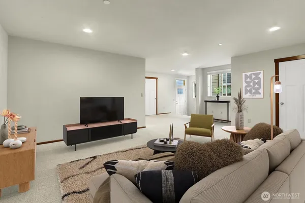 a bedroom with a bed and a painting on the wall