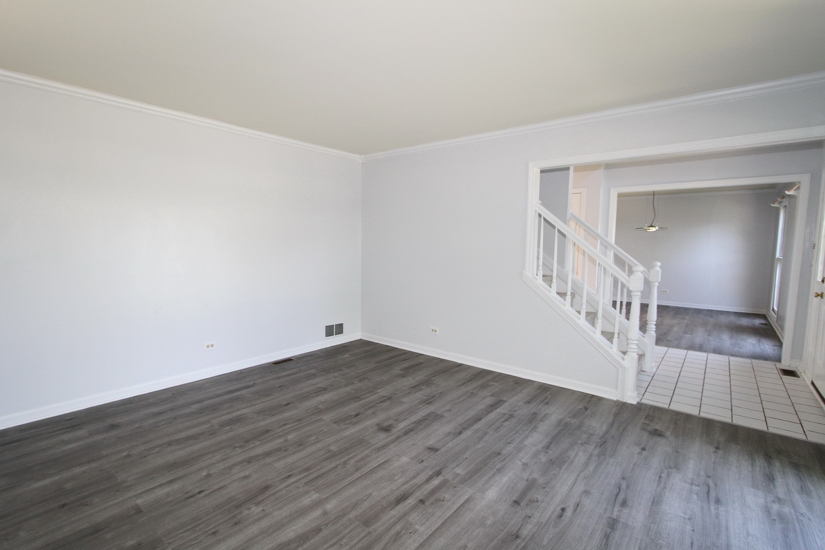 1960 Slippery Rock Road Naperville, IL 60565 - Photo 2 of 22 a view of an empty room with wooden floor