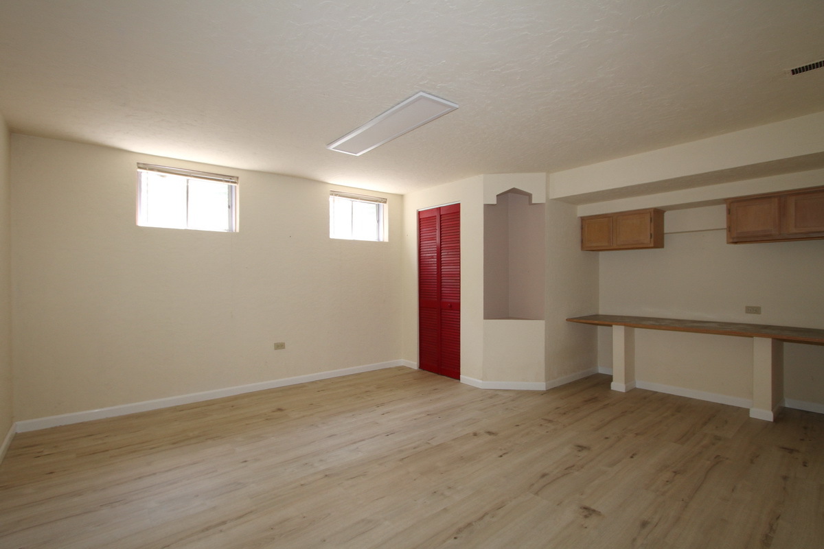 1960 Slippery Rock Road Naperville, IL 60565 - Photo 21 of 22 a view of an empty room with wooden floor and a window