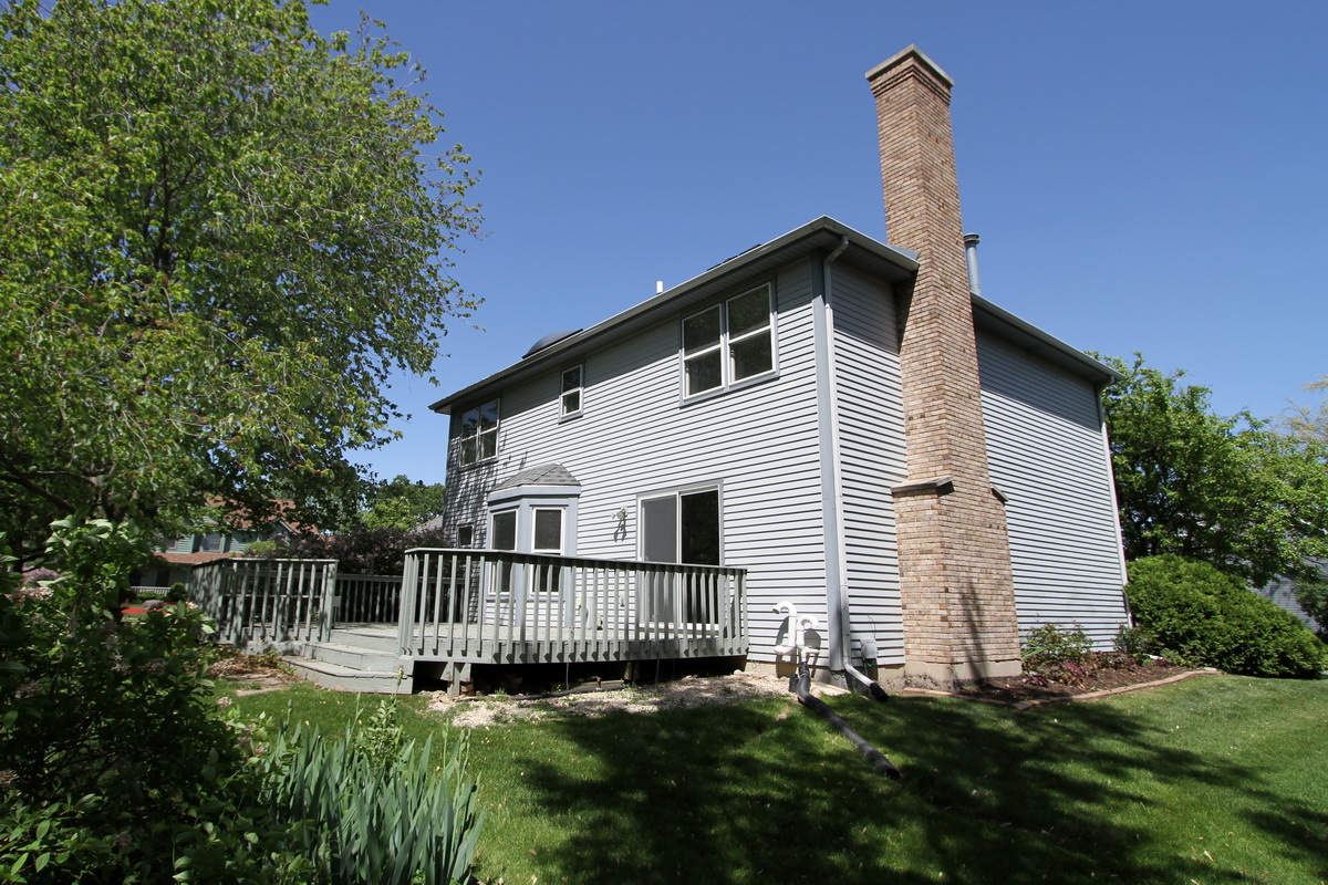 1960 Slippery Rock Road Naperville, IL 60565 - Photo 22 of 22 a view of a house with a yard