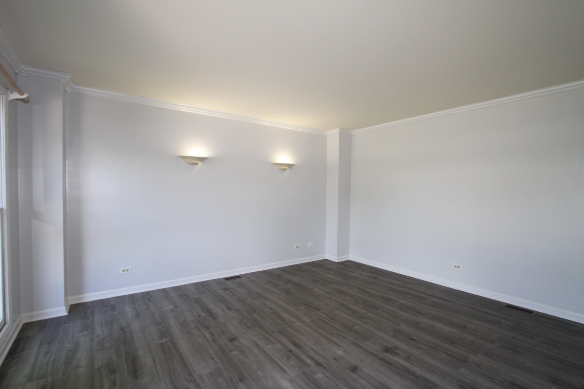 1960 Slippery Rock Road Naperville, IL 60565 - Photo 3 of 22 a view of an empty room with wooden floor