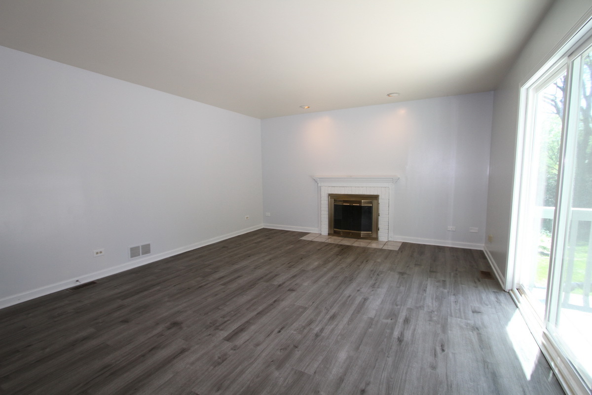 1960 Slippery Rock Road Naperville, IL 60565 - Photo 6 of 22 an empty room with wooden floor and a window