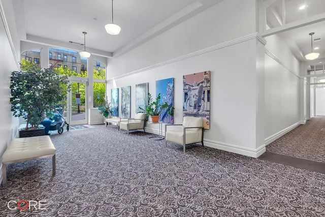 a living room with furniture and a pool table