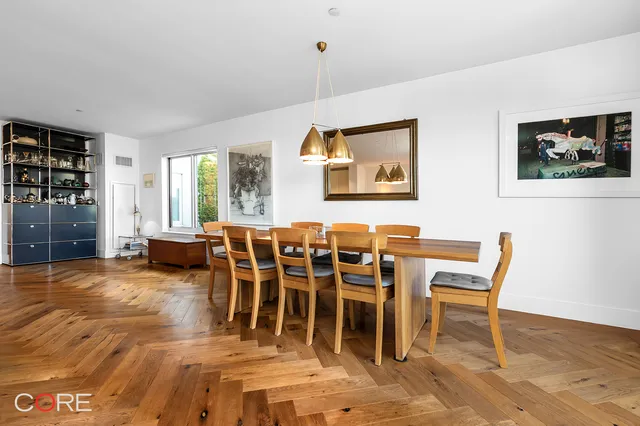 a kitchen with kitchen island a counter appliances a sink and cabinets